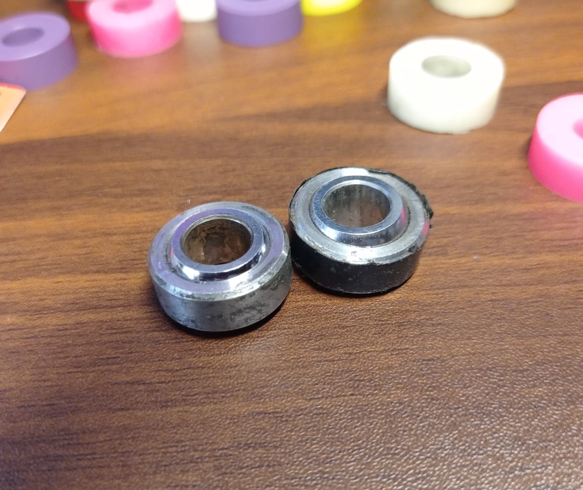 two spherical inserts, one has been wrapped with black tape